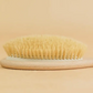 Cette brosse à cheveux naturelle
